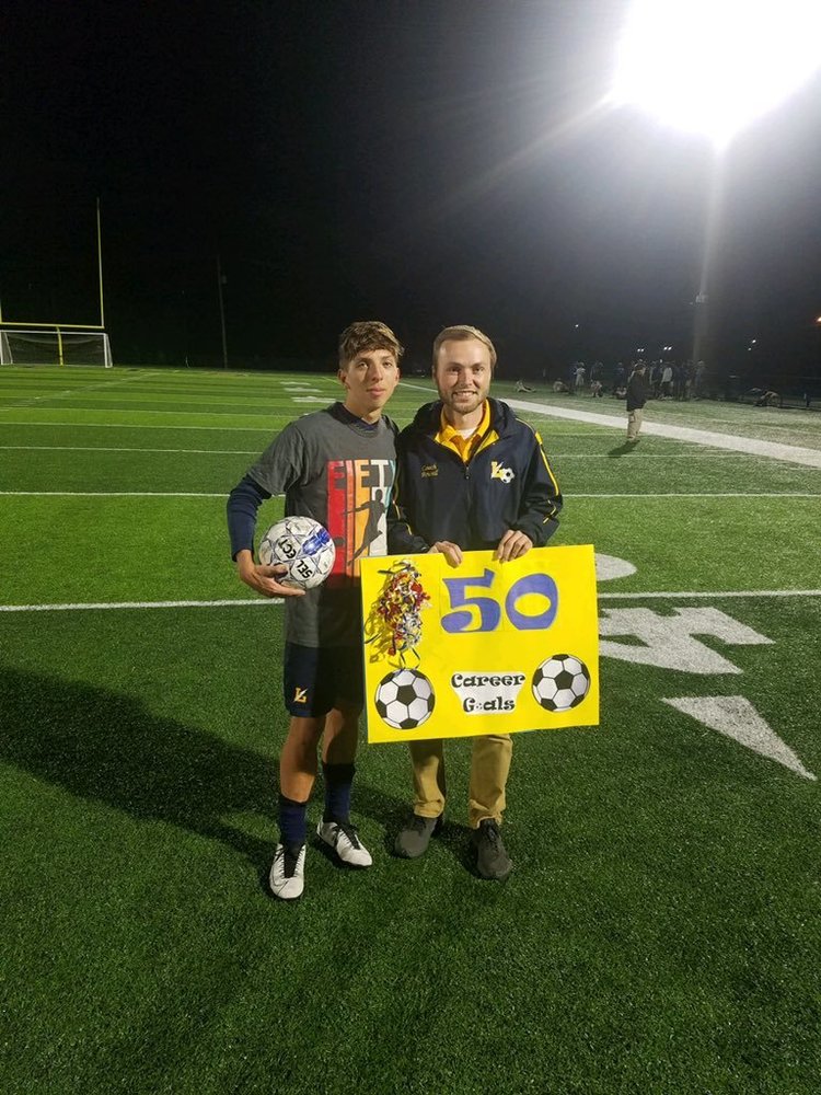 Josh Blose and Coach Powell on soccer field
