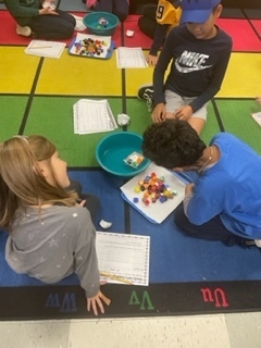 students making small plastic boat