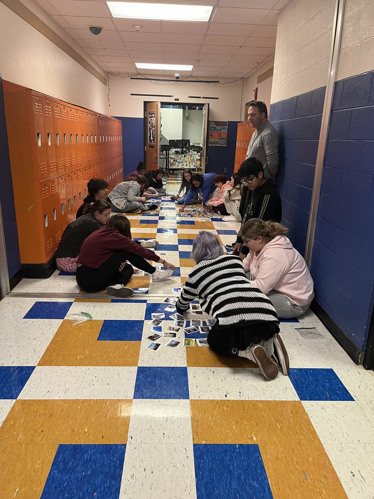 Mr. Capik's photography class playing dominoes with the elements of art